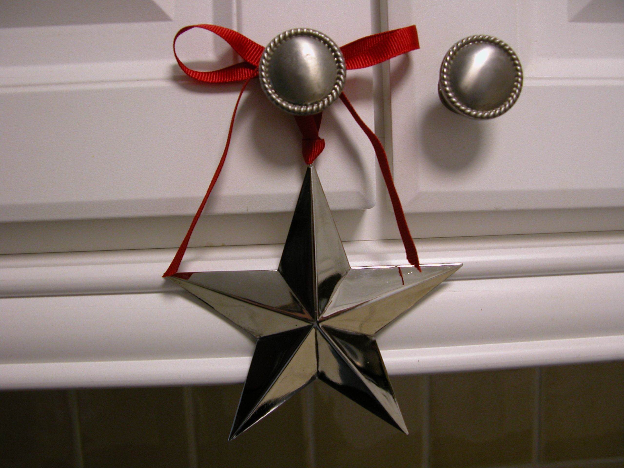 Star Christmas Ornament on Kitchen Cabinet Star Christmas Ornament on Kitchen Cabinet
